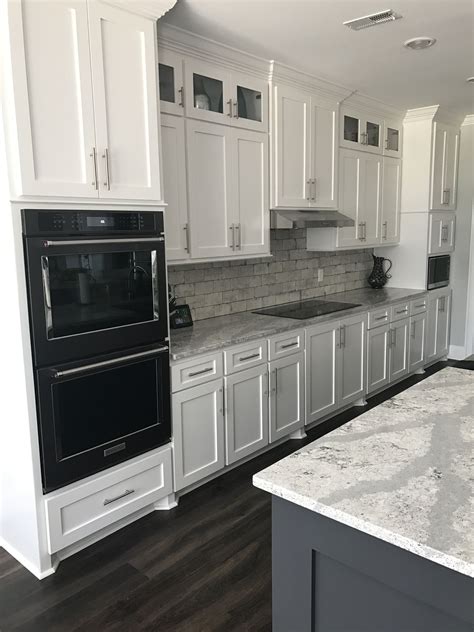 pictures of kitchen white cabinets and black stainless steel appliances|black fridge in white kitchen.